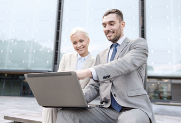 Sticker - smiling businesspeople with laptop outdoors