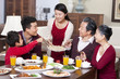 © Blue Jean Images - Merry family having Chinese New Year dinner