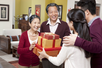 Wall Mural - Family visiting with gifts during Chinese New Year