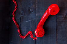 The Image Represents A Vintage Red Phone On A Dark Wood Background Conceptualizing Communication Or Lack Thereof