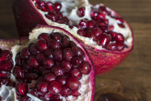 Pomegranate On Wooden Table