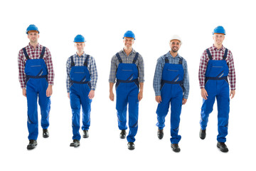 Wall Mural - Portrait Of Confident Male Carpenters Walking In Row