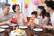 © Blue Jean Images - Happy family celebrating birthday