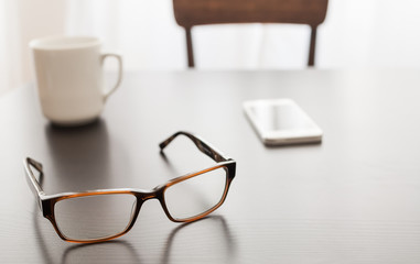 View of a cup of coffee and smart phone.