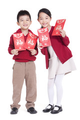 Wall Mural - Cheerful boy and girl holding red pockets