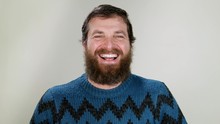 Hipster Man Laughing Out Loud On Neutral Background