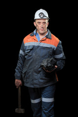 coalminer holds out a large chunk of energy rich coal 