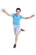© Blue Jean Images - Excited young man jumping in mid air