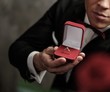 Man holding box with a proposal ring