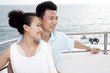 © Blue Jean Images - Couple Relaxing on a Yacht
