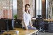 © Blue Jean Images - Young woman sitting in office