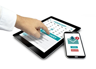 Canvas Print - group of touchscreen devices with productivity apps and a finger