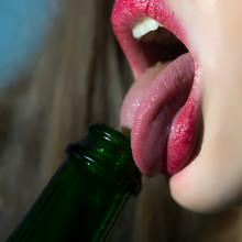 Woman Licking Bottle