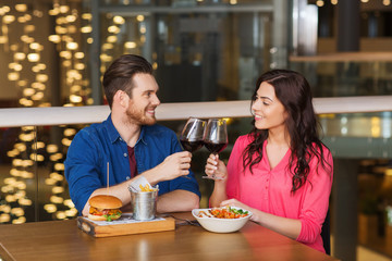 Poster - happy couple dining and drink wine at restaurant