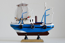Blue Toy Fishing Boat With White Background