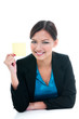 © iPortret - Businesswoman Holding Yellow Post-it Note