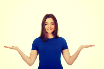 Smiling woman showing something on palms.