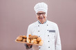 Portrait of happy baker chef in working uniform