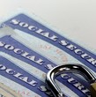 © larryhw - Padlock and social security card - Identity theft and identity protection concept