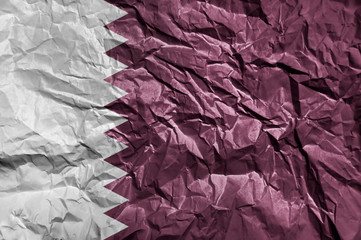 Wall Mural - Qatar flag painted on crumpled paper background