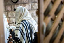 Jewish Men Praying In A Synagogue With Tallit 