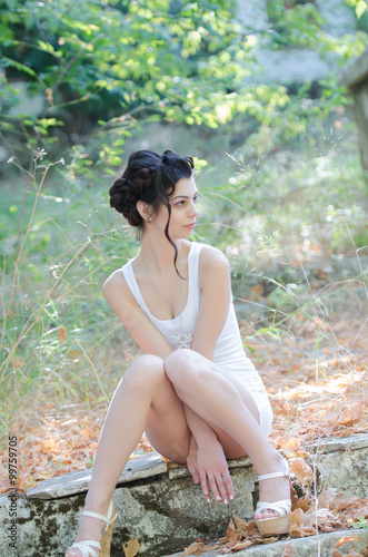 Sexy Slim Lady Wear Tight Short White Dress Sitting On Sidewalk With