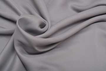 Shiny elegant silver satin silk fabric background