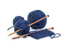 Balls Of Wool Blue Colors And Knitting On Wooden Needles