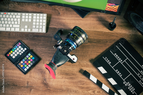 Fotografie, Obraz Desktop top shot of a modern Cinema Camera on stylish wooden workplace