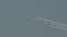 Twelve T-6 Harvard Trainers (also Known As A Texans) Flying In Diamond Formation And Leaving Smoke Trails.  Used By Canada And The United States For Pilot Training.
