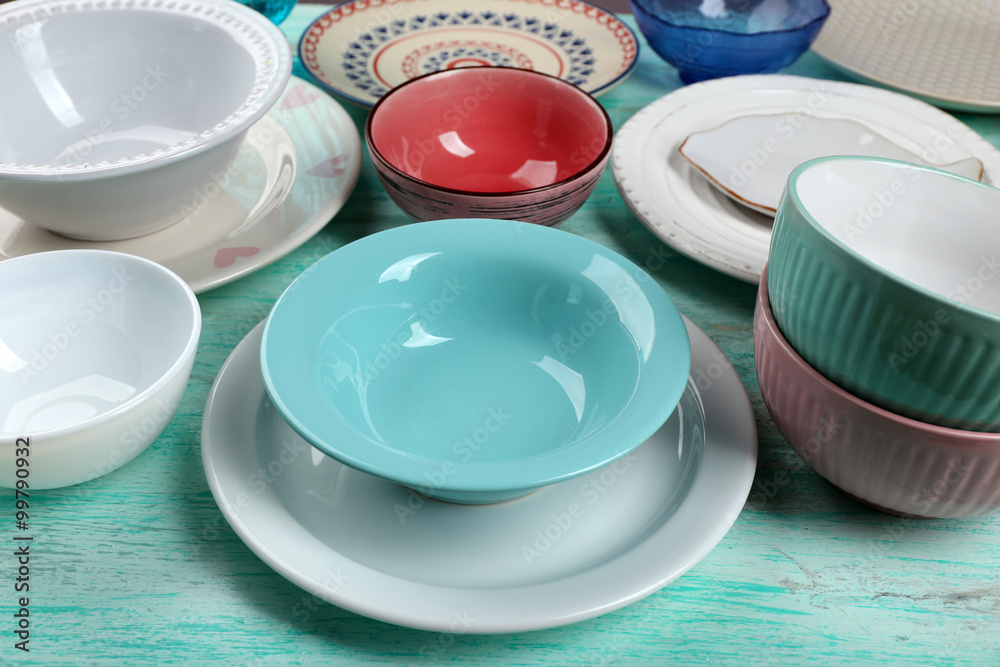 Different tableware on wooden table close up