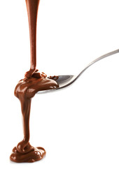 Poster - Melted milky brown chocolate pouring from a spoon, isolated on white