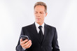 © deagreez - A handsome mature businessman with modern mobile phone