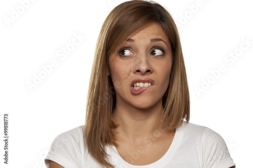 Fotografía scared and worried young woman on a white background
