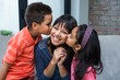 © WavebreakMediaMicro - Happy mother being kissed by her children