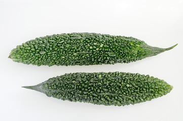 Green bitter gourd on white background