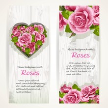 Pink Roses On Two Vertical Banners On A White Wood Background