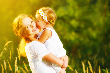 Happy family on summer. little girl child baby daughter hugging