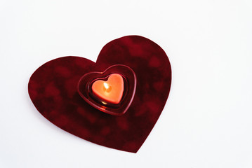 Wall Mural - heart red candle on velvet isolated on white background, valenti