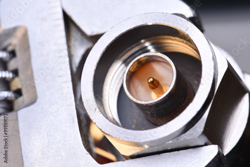 Fotografía Closeup of coax connector with tool wrench, coaxial network technology