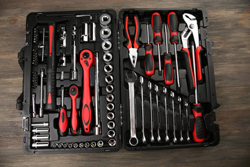 Wall Mural - Tools in box on wooden background