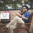 © Rawpixel.com - Man Shopping Outdoor Talking Mobile Phone Concept