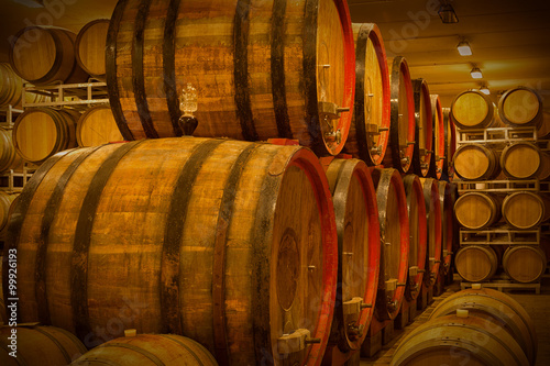 Cellar with barrels for storage of wine, Italy Poster