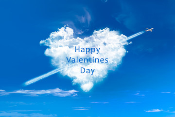 Wall Mural - Valentines day card, heart shaped clouds in blue sky with plane