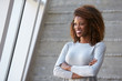 © Monkey Business - African American Businesswoman Standing Against Office Wall