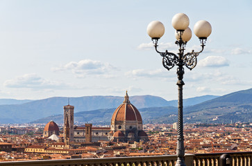 Beautiful view over the city of Florence, Italy, with the Cathedral and a beautiful street light