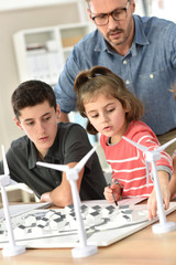 Wall Mural - Elementary school pupils learning about renewable energy