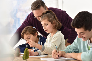 Wall Mural - Pupils taking notes during science class