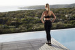 © sanneberg - Yong blond athlete in sportswear enjoying view from poolside