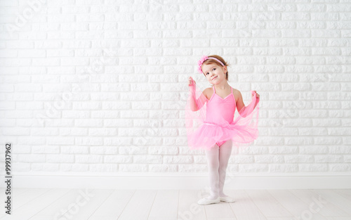 Obraz Dibond little child girl dreams of becoming ballerina